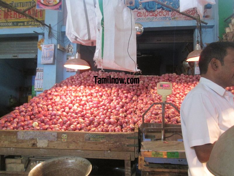Heap of onions for sale at koyambedu vegetable market 154