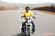 Arya On Bike In Meagaamann Tamil Movie 91